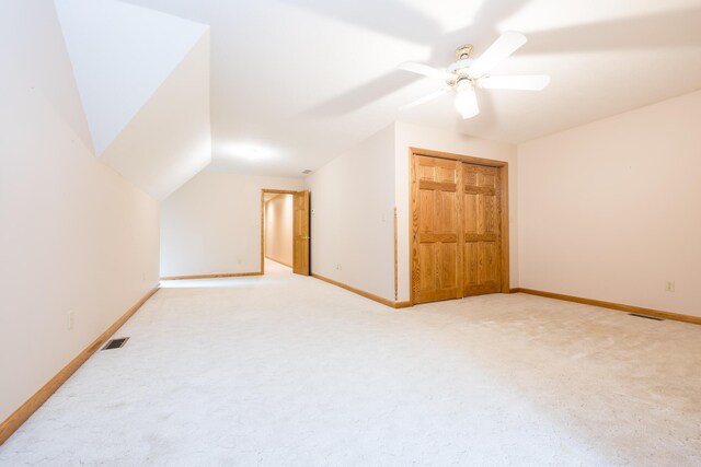 129 Tanglewood Dr, West Liberty, OH 43357 - additional living space featuring baseboards, light colored carpet, vaulted ceiling, and a ceiling fan