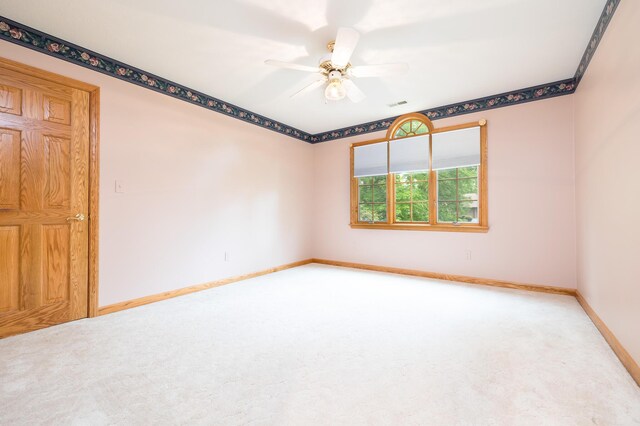 129 Tanglewood Dr, West Liberty, OH 43357 - carpeted spare room with baseboards and ceiling fan
