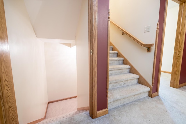 129 Tanglewood Dr, West Liberty, OH 43357 - staircase featuring carpet and baseboards