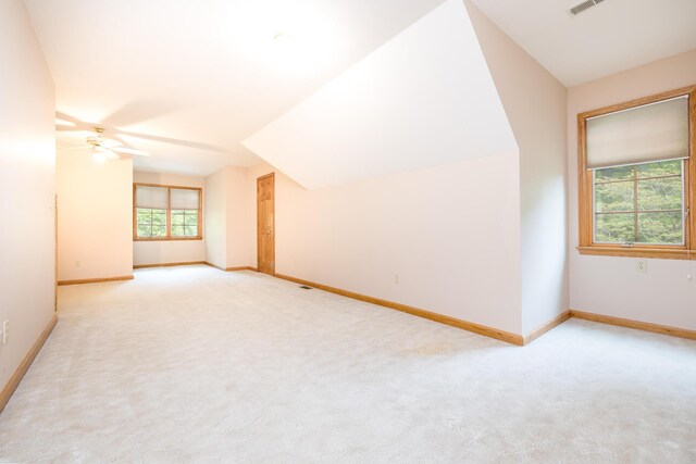 129 Tanglewood Dr, West Liberty, OH 43357 - bonus room featuring light colored carpet, a ceiling fan, baseboards, and lofted ceiling