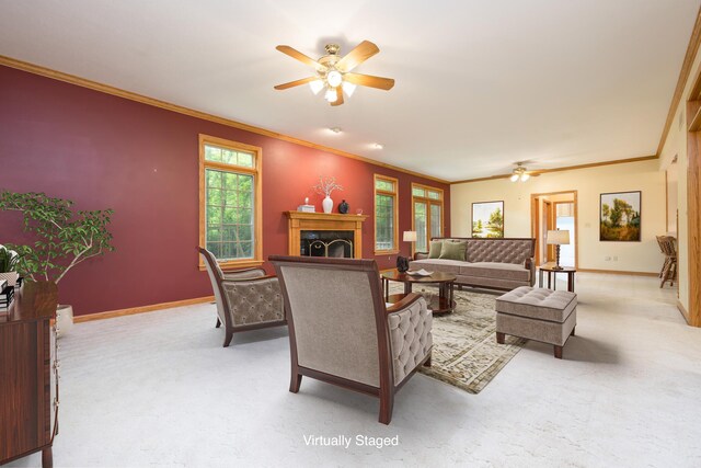 129 Tanglewood Dr, West Liberty, OH 43357 - living area with ceiling fan, ornamental molding, a fireplace, baseboards, and carpet floors