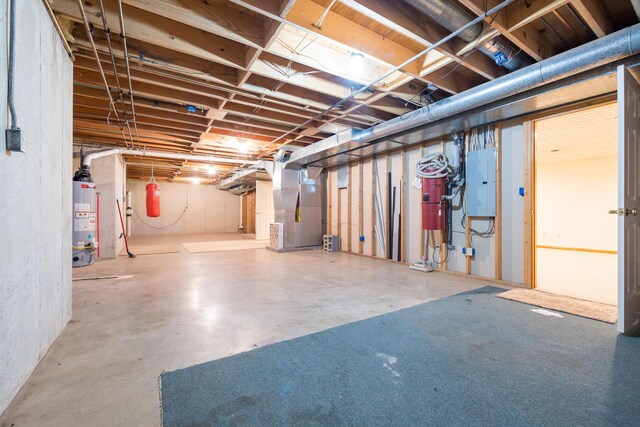 129 Tanglewood Dr, West Liberty, OH 43357 - unfinished basement featuring water heater, electric panel, and heating unit