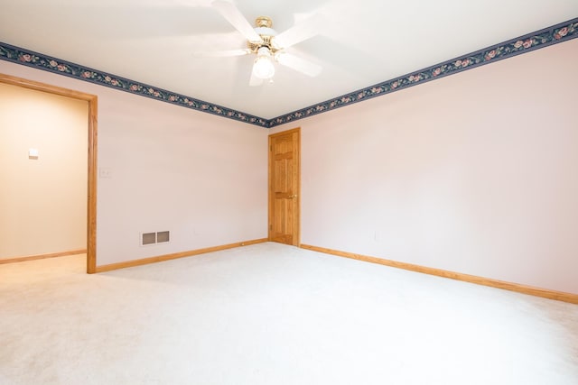 129 Tanglewood Dr, West Liberty, OH 43357 - spare room featuring baseboards, light carpet, and ceiling fan