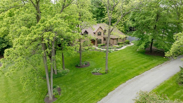 129 Tanglewood Dr, West Liberty, OH 43357 - aerial view of property and surrounding area with a heavily wooded area