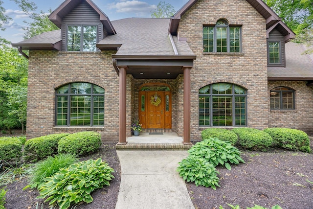129 Tanglewood Dr, West Liberty, OH 43357 - view of front of property with brick siding and roof with shingles