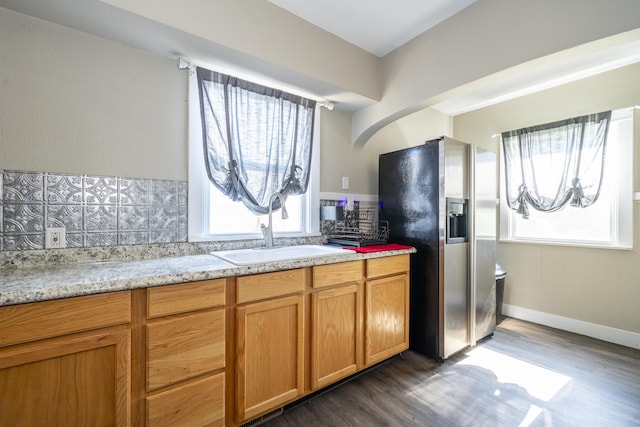 1920 Coventry Rd, Dayton, OH 45420 - kitchen with a sink, stainless steel fridge, dark wood-style flooring, and backsplash