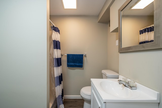 1920 Coventry Rd, Dayton, OH 45420 - bathroom featuring toilet, vanity, baseboards, a shower with shower curtain, and wood finished floors