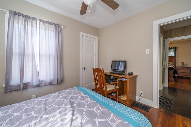 1920 Coventry Rd, Dayton, OH 45420 - bedroom featuring wood finished floors, multiple windows, baseboards, and a ceiling fan