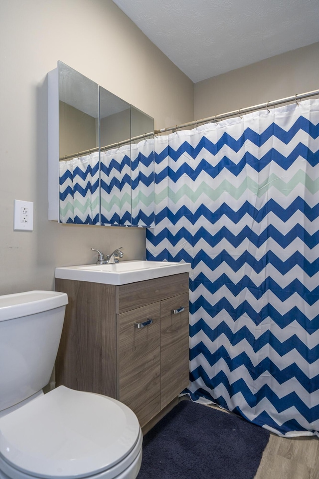 1920 Coventry Rd, Dayton, OH 45420 - full bathroom with toilet, vanity, wood finished floors, and curtained shower