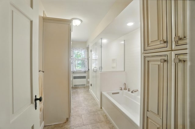1010 Glynwood Rd, Wapakoneta, OH 45895 - full bath with radiator, a garden tub, tile patterned floors, and a shower with door