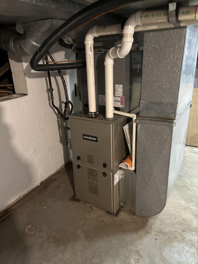 utility room with heating unit