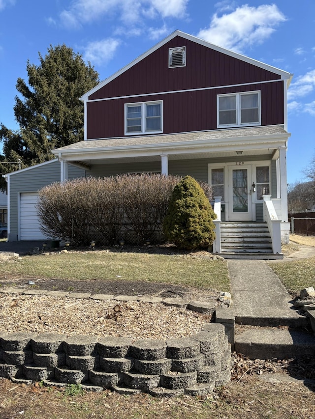 view of front of house featuring a garage and covered porch