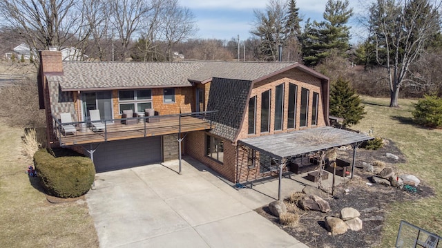 view of front facade featuring a chimney, concrete driveway, roof with shingles, and an attached garage