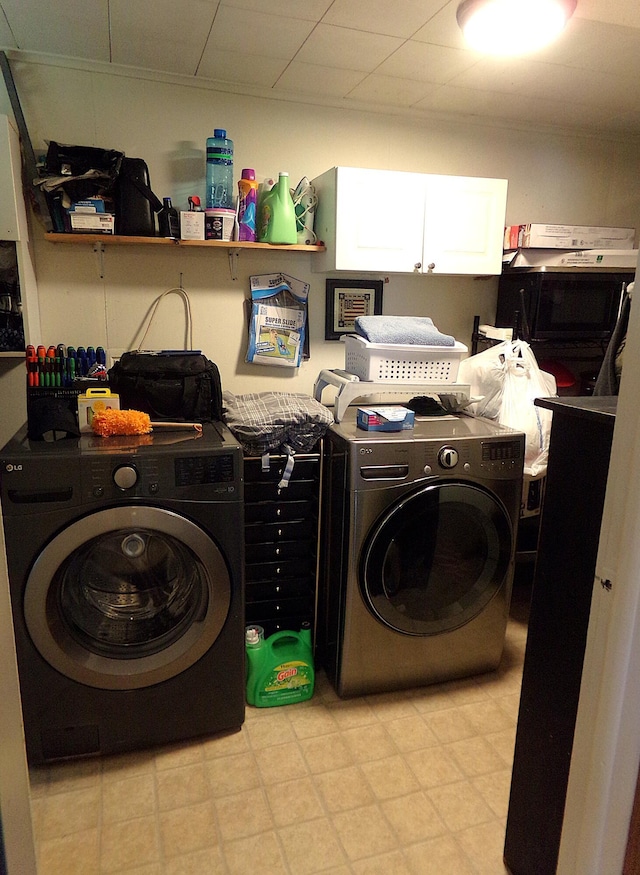 88 E Clark St, North Hampton, OH 45349 - laundry area featuring washing machine and dryer and cabinet space