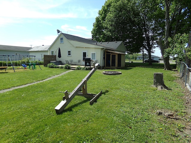 88 E Clark St, North Hampton, OH 45349 - back of house with an outdoor fire pit