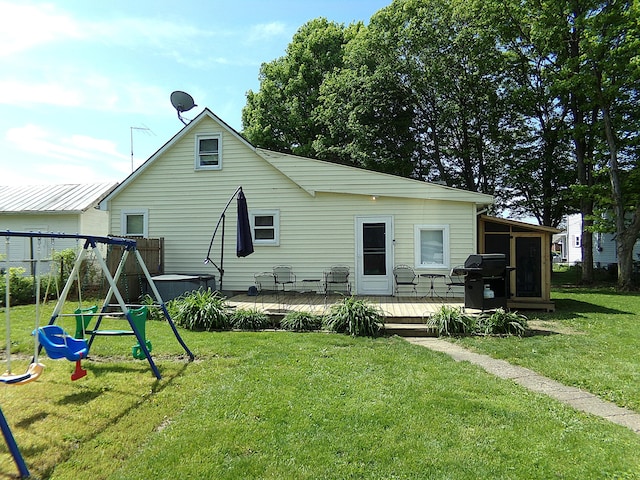 88 E Clark St, North Hampton, OH 45349 - rear view of property featuring a playground, a wooden deck, and a sunroom