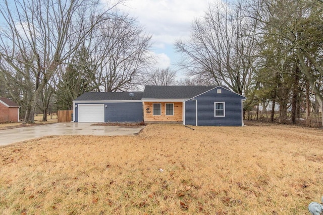 single story home featuring a garage and a front yard