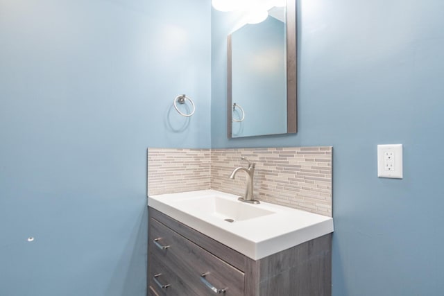 bathroom with vanity and backsplash