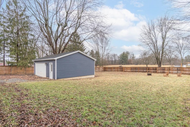 view of yard with a garage and an outdoor structure