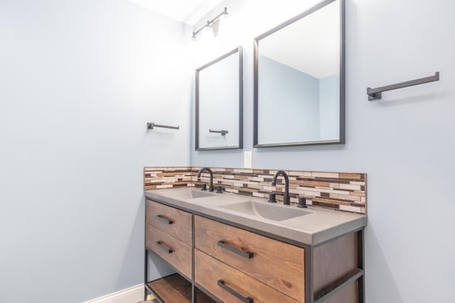 bathroom featuring vanity and decorative backsplash