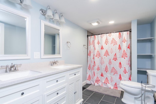 bathroom featuring vanity, tile patterned floors, toilet, and walk in shower