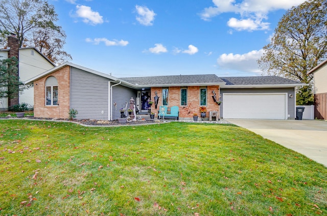 single story home featuring a garage and a front lawn