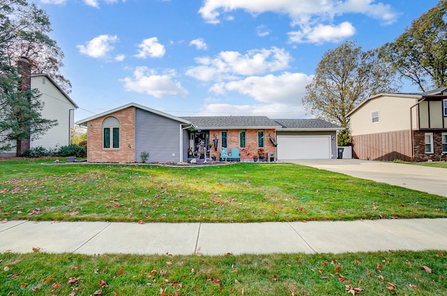 view of front of property featuring a garage and a front yard