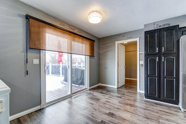 unfurnished room featuring hardwood / wood-style flooring