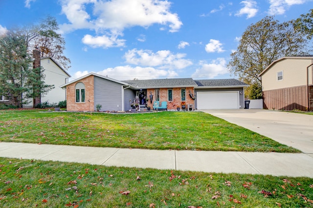 ranch-style home featuring a garage and a front lawn