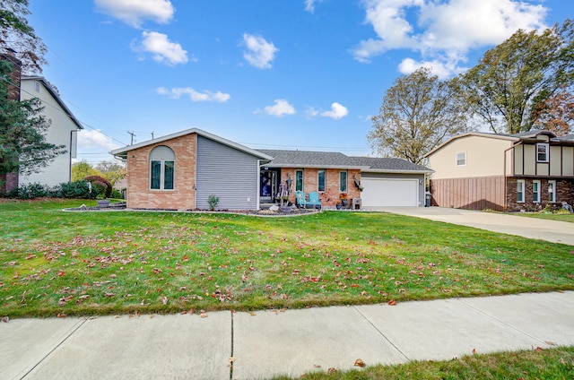 view of front of property with a garage and a front lawn