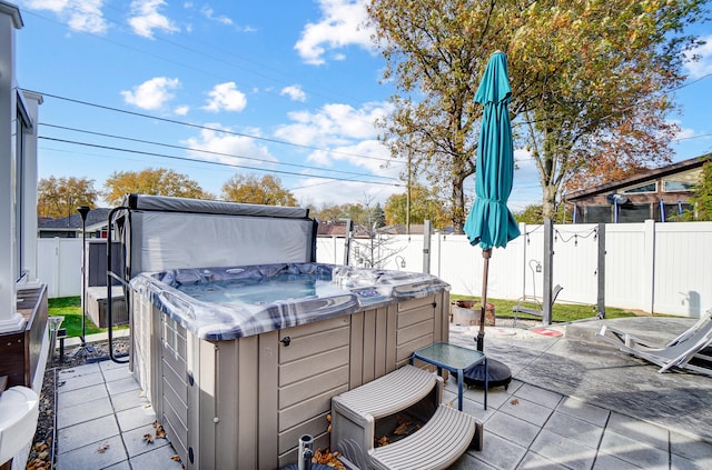 view of patio / terrace featuring a hot tub