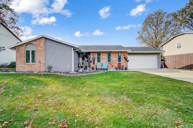 single story home featuring a garage and a front yard