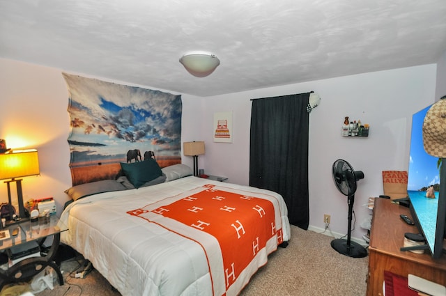 bedroom with carpet and baseboards