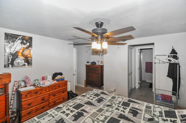 bedroom featuring a ceiling fan and baseboards