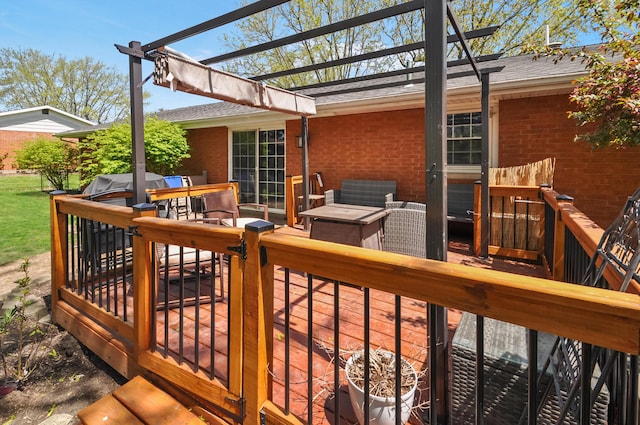 wooden terrace featuring a pergola and an outdoor hangout area