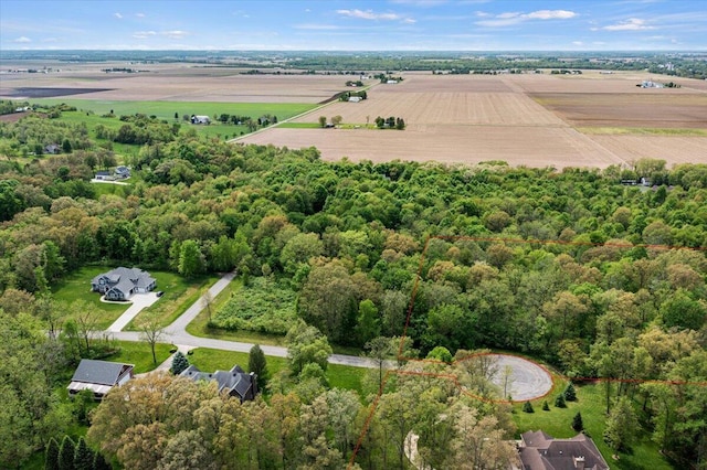 birds eye view of property with a rural view