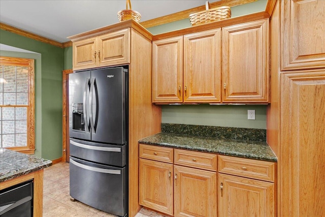 kitchen with wine cooler, light tile patterned flooring, black fridge, dark stone countertops, and crown molding