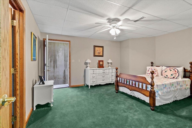 bedroom with baseboards, visible vents, a ceiling fan, a paneled ceiling, and carpet floors