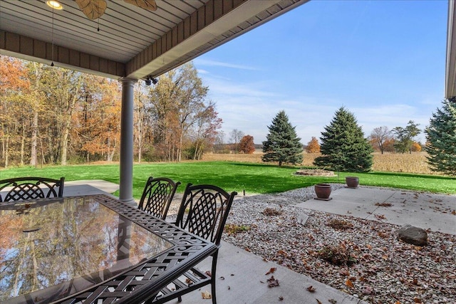 view of patio with a ceiling fan and outdoor dining space