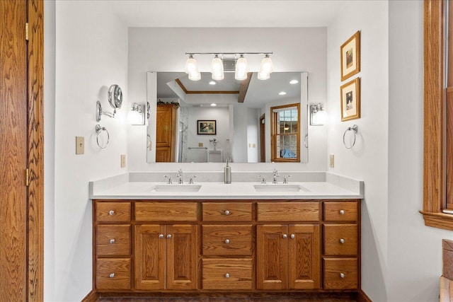 full bath featuring double vanity and a sink