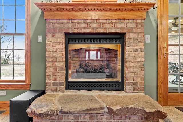 interior details with a fireplace with raised hearth