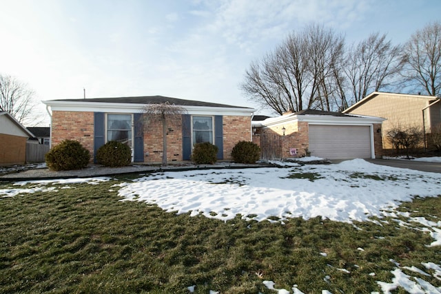 view of front facade with a yard and a garage