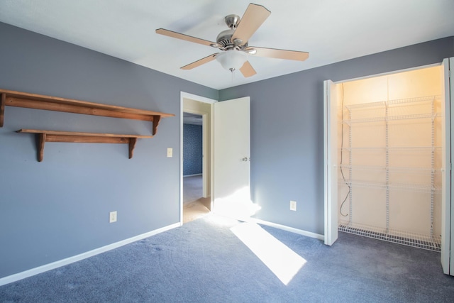 unfurnished bedroom with ceiling fan and carpet