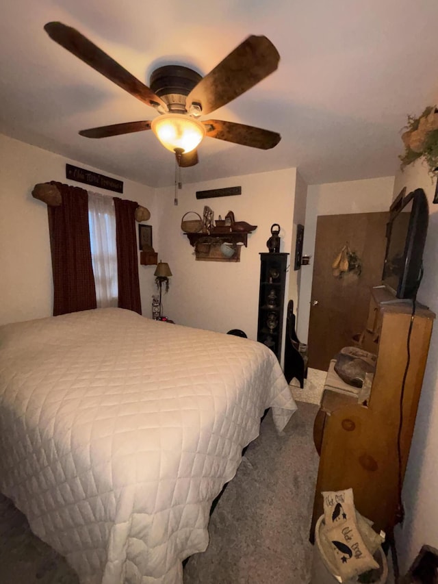 carpeted bedroom featuring a ceiling fan