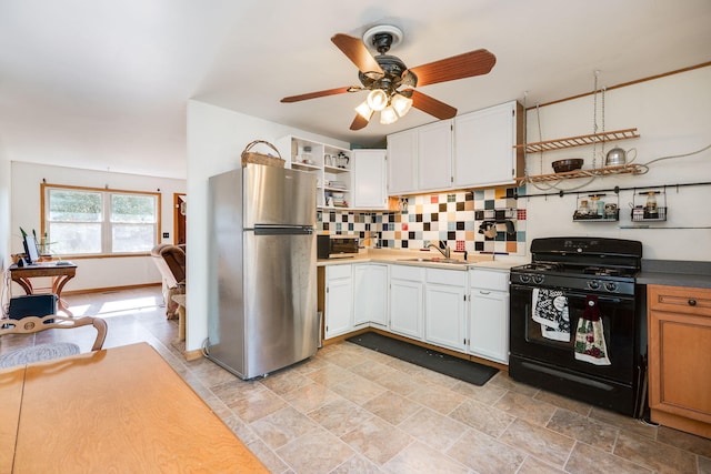 413 Weinland St, New Carlisle, OH 45344 - kitchen with appliances with stainless steel finishes, open shelves, decorative backsplash, a ceiling fan, and white cabinetry