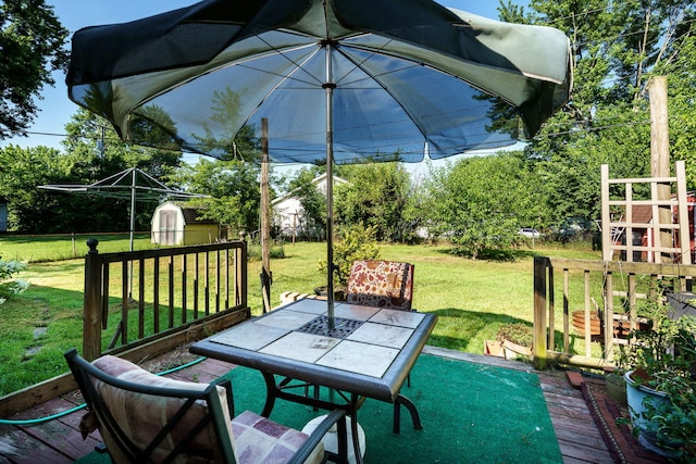 413 Weinland St, New Carlisle, OH 45344 - view of patio / terrace with a shed, outdoor dining area, and a wooden deck