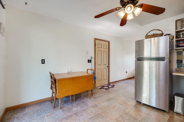 413 Weinland St, New Carlisle, OH 45344 - dining room featuring ceiling fan and stone finish flooring