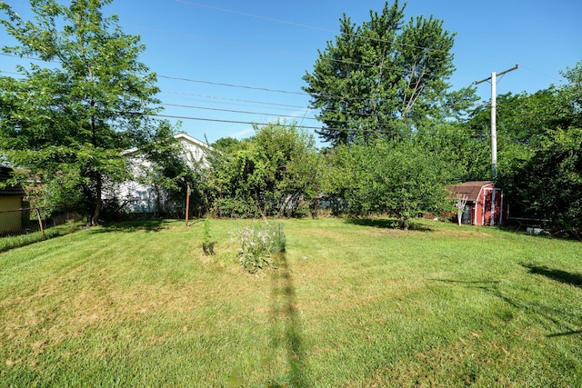413 Weinland St, New Carlisle, OH 45344 - view of yard with a storage unit
