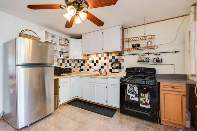 413 Weinland St, New Carlisle, OH 45344 - kitchen featuring stainless steel appliances, open shelves, tasteful backsplash, ceiling fan, and white cabinets