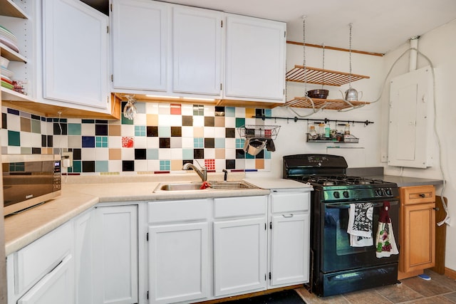 413 Weinland St, New Carlisle, OH 45344 - kitchen featuring black gas stove, electric panel, stainless steel microwave, open shelves, and white cabinetry